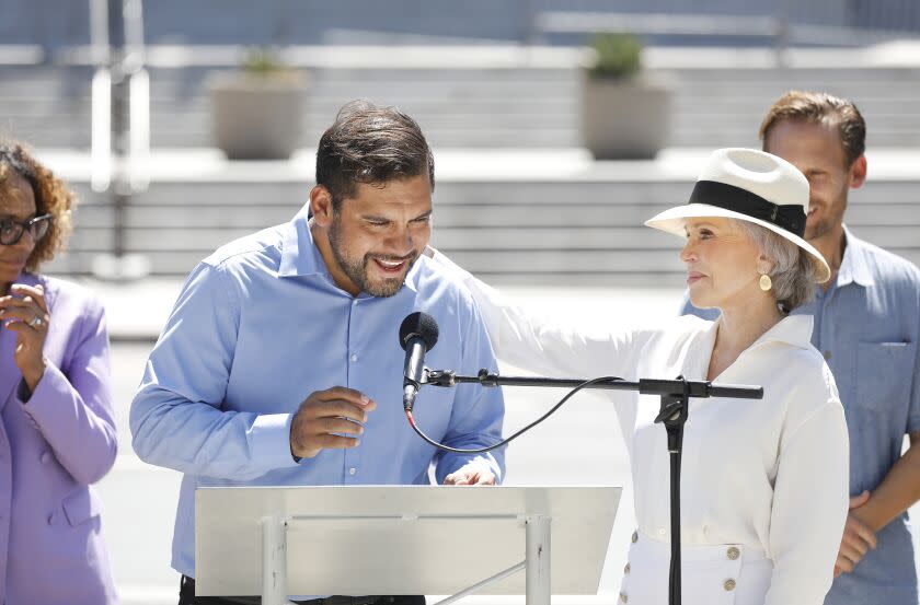 LOS ANGELES, CA - SEPTEMBER 1, 2022: Jane Fonda, right, holds a press conference to announce the Jane Fonda Climate PAC's endorsement of a slate of Los Angeles area candidates including Hugo Soto-Martinez,left, who is running for L.A. City Council-District 13, at Grand Park in downtown Los Angeles on Thursday, September 1, 2022. (Christina House / Los Angeles Times)