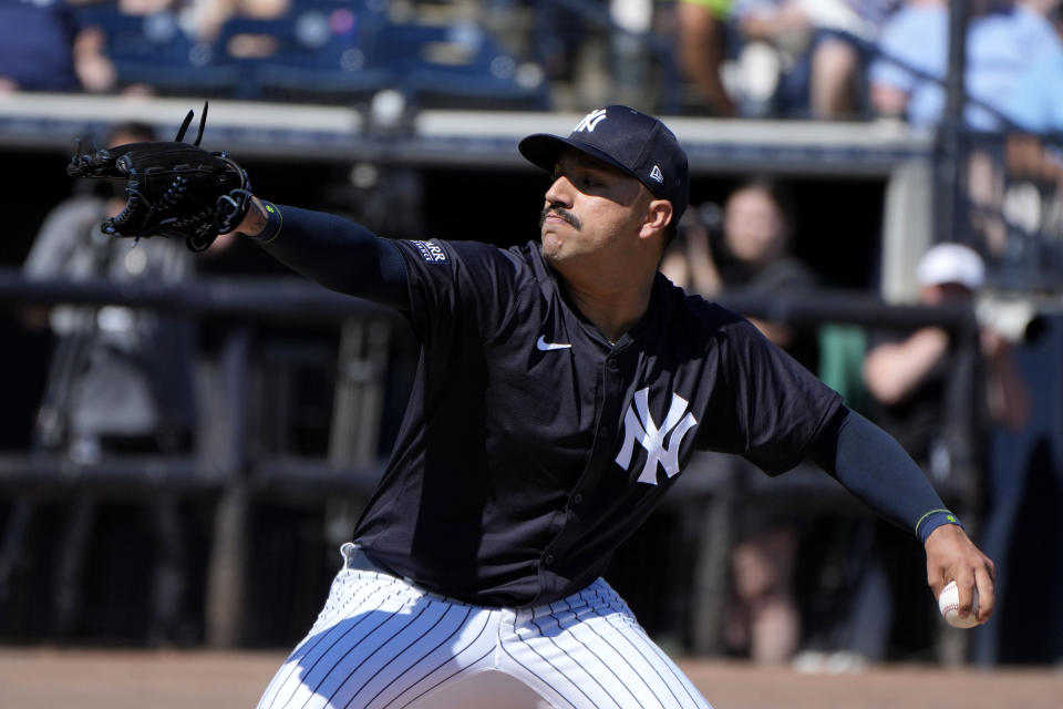 New York Yankees starting pitcher Nestor Cortes (65) throws a pitch during the first inning of a spring training baseball game against the Minnesota Twins Monday, Feb. 26, 2024, in Tampa, Fla. (AP Photo/Charlie Neibergall)