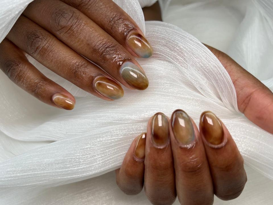 Earth-toned nails.