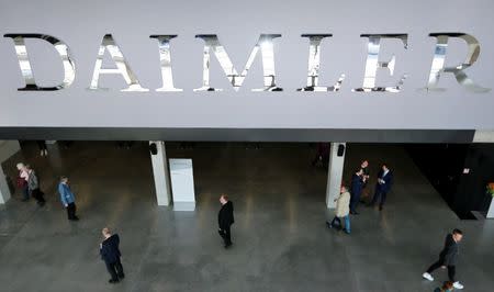 FILE PHOTO: The Daimler logo is seen before the Daimler annual shareholder meeting in Berlin, Germany, April 5, 2018. REUTERS/Hannibal Hanschke