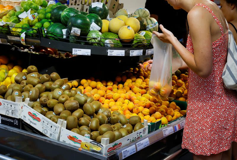 A customer shops in a supermarket in Nice