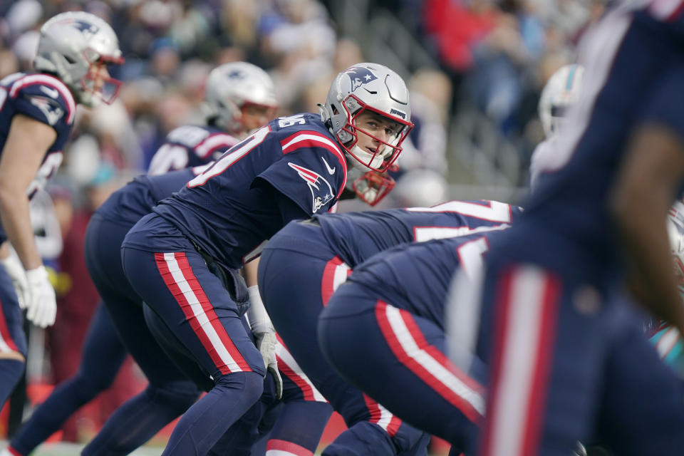 New England Patriots quarterback Mac Jones (10) prepares to take the snap against the Miami Dolphins first half of an NFL football game, Sunday, Jan. 1, 2023, in Foxborough, Mass. (AP Photo/Steven Senne)