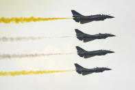 Members of the "August 1st" Aerobatic Team of the Chinese People's Liberation Army (PLA) Air Force perform during the 13th China International Aviation and Aerospace Exhibition, also known as Airshow China 2021, on Tuesday, Sept. 28, 2021 in Zhuhai in southern China's Guangdong province. (AP Photo/Ng Han Guan)