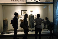 <p>Visitors to the new Museum of Mississippi History examine examples of clothing in the Civil War gallery during a “sneak peak” for media and invited guests to the state’s two new facilities in Jackson, Miss., Tuesday, Nov. 7, 2017. (Photo: Rogelio V. Solis/AP) </p>