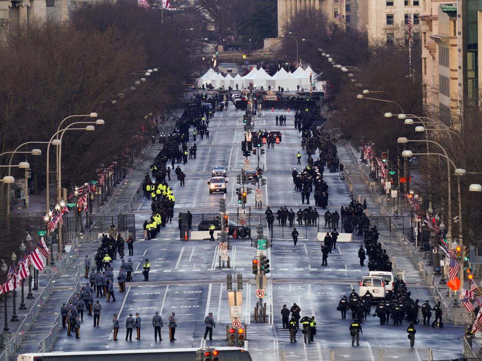 Security is set up along Pennsylvania Avenue before the 59th Presidential Inauguration. Security officials have assured that there will be extremely tight security around the entire capital region on Inauguration Day after pro-Trump rioters breached the Capitol on 6 January AP