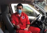 Nadim Kahwaji, a 23-year-old first responder at Lebanese Red Cross is pictured inside a vehicle, in Beirut