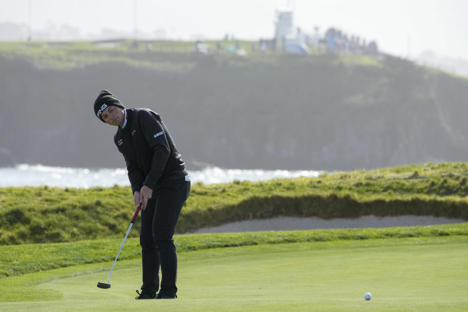 Viktor Hovland, of Norway, follows his putt on the 17th green of the Pebble Beach Golf Links during the third round of the AT&T Pebble Beach Pro-Am golf tournament in Pebble Beach, Calif., Sunday, Feb. 5, 2023. (AP Photo/Godofredo A. Vásquez)