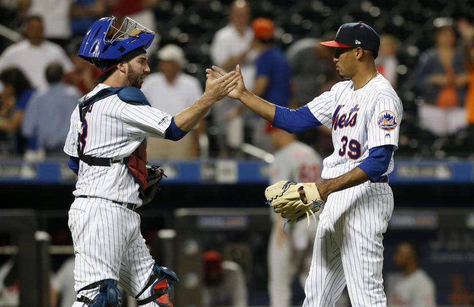 NEW YORK, NEW YORK - JULY 06:   Tomas Nido #3 and Edwin Diaz #39 of the New York Mets in action against the Philadelphia Phillies at Citi Field on July 06, 2019 in New York City.  The Mets defeated the Phillies 6-5. (Photo by Jim McIsaac/Getty Images)