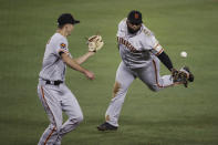 San Francisco Giants' Pablo Sandoval, right, tosses the ball to relief pitcher Tyler Rogers for the out on Los Angeles Dodgers' Max Muncy at first base during the eighth inning of a baseball game Sunday, July 26, 2020, in Los Angeles. (AP Photo/Jae C. Hong)