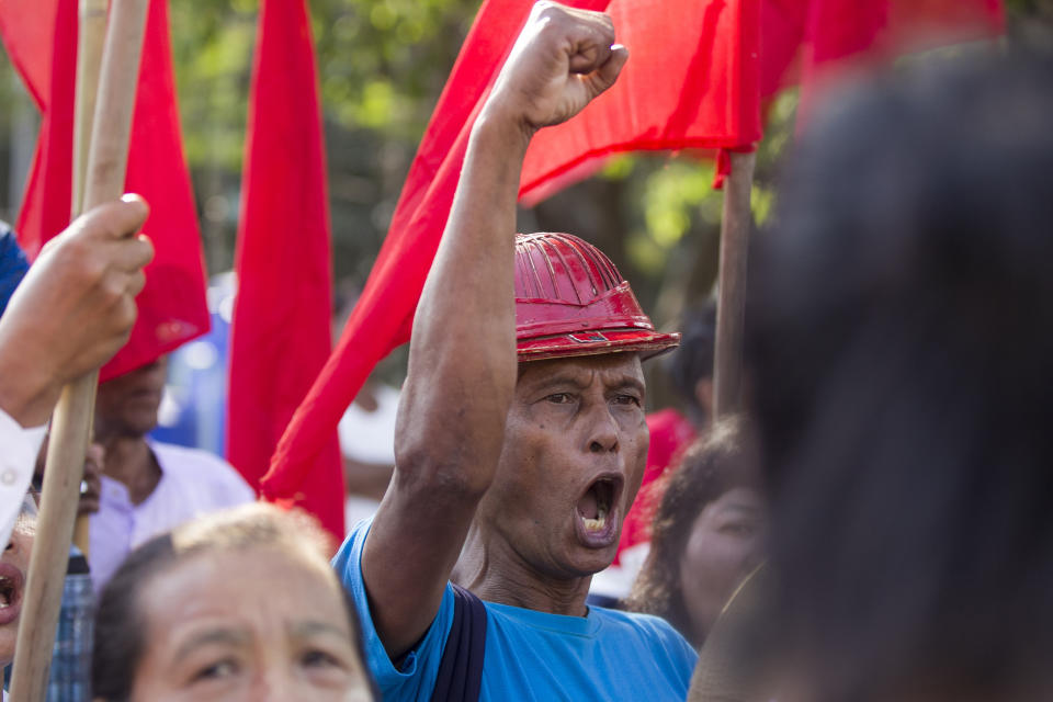 FILE - Activists shout slogans during a protest against Myitsone dam project on the Irrawaddy River in Kachin State, in front of city hall in Yangon, Myanmar Saturday, Jan. 18, 2019. Myanmar's military government appears to be reviving consideration of a massive China-backed hydroelectric dam project, work on which was suspended more than a decade ago after protests over its possible impact on the environment. (AP Photo/Thein Zaw, File)