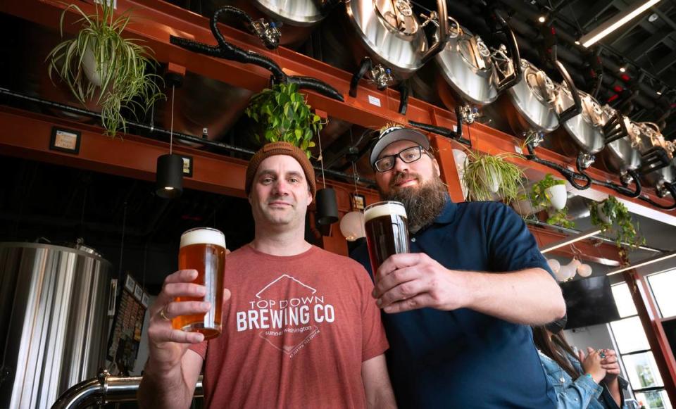 Brewery owners Greg Burd (left) and Chad Cray at Top Down Brewing Co. in Sumner, Washington, on Wednesday, April 5, 2023.