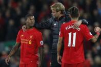 Britain Soccer Football - Liverpool v West Bromwich Albion - Premier League - Anfield - 22/10/16 Liverpool manager Juergen Klopp celebrates after the game with Georginio Wijnaldum and Roberto Firmino Action Images via Reuters / Ed Sykes