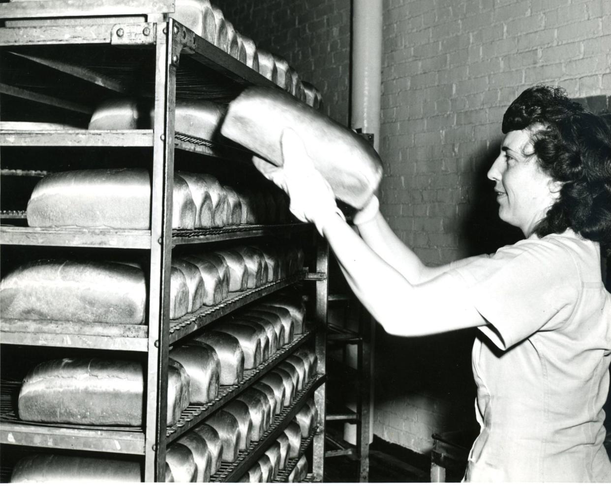 Bernice McClelland loads a cart with freshly baked loaves in 1946 at the Wonder Bread bakery at 178 S. Forge St. in Akron