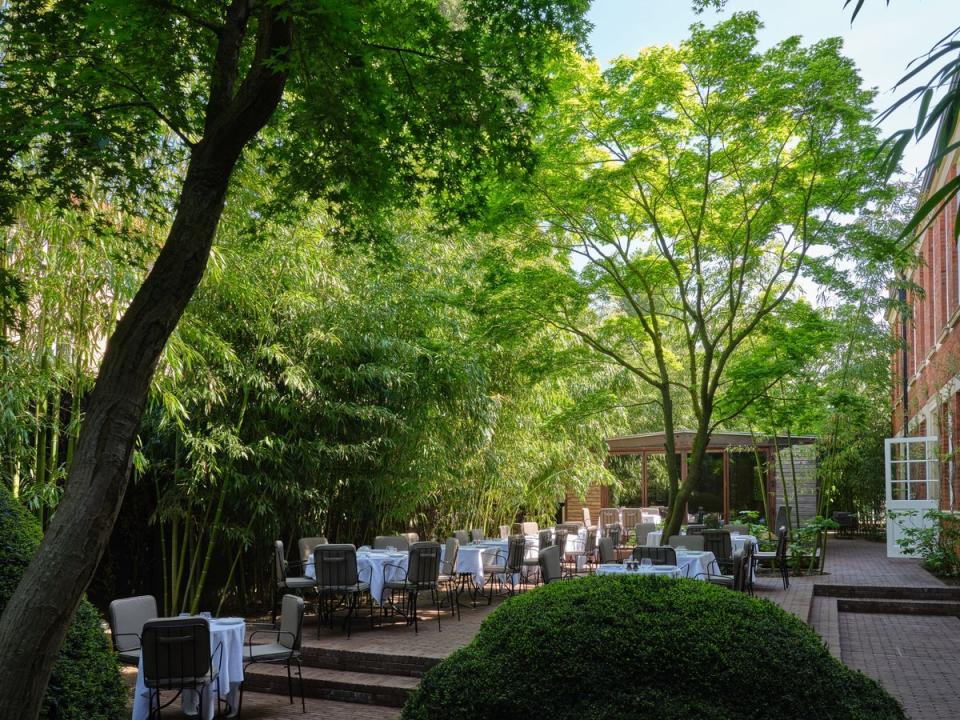 A Jean Prouvé Maison Démontable serves as a private dining space (David Brook)