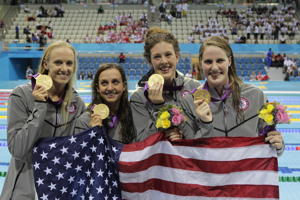 The U.S. women’s team set a new record in London for the 4x100m medley relay improving .14 on a 3-year-old record by China. (L-R) <a href="http://yhoo.it/NiOrk7" rel="nofollow noopener" target="_blank" data-ylk="slk:Dana Vollmer;elm:context_link;itc:0;sec:content-canvas" class="link ">Dana Vollmer</a>, <a href="http://yhoo.it/NiOHzG" rel="nofollow noopener" target="_blank" data-ylk="slk:Rebecca Soni;elm:context_link;itc:0;sec:content-canvas" class="link ">Rebecca Soni</a>, <a href="http://yhoo.it/M3Dqle" rel="nofollow noopener" target="_blank" data-ylk="slk:Allison Schmitt;elm:context_link;itc:0;sec:content-canvas" class="link ">Allison Schmitt</a>, and <a href="http://yhoo.it/O1XHHB" rel="nofollow noopener" target="_blank" data-ylk="slk:Missy Franklin;elm:context_link;itc:0;sec:content-canvas" class="link ">Missy Franklin</a> hold their gold medals after the race. (Getty Images)
