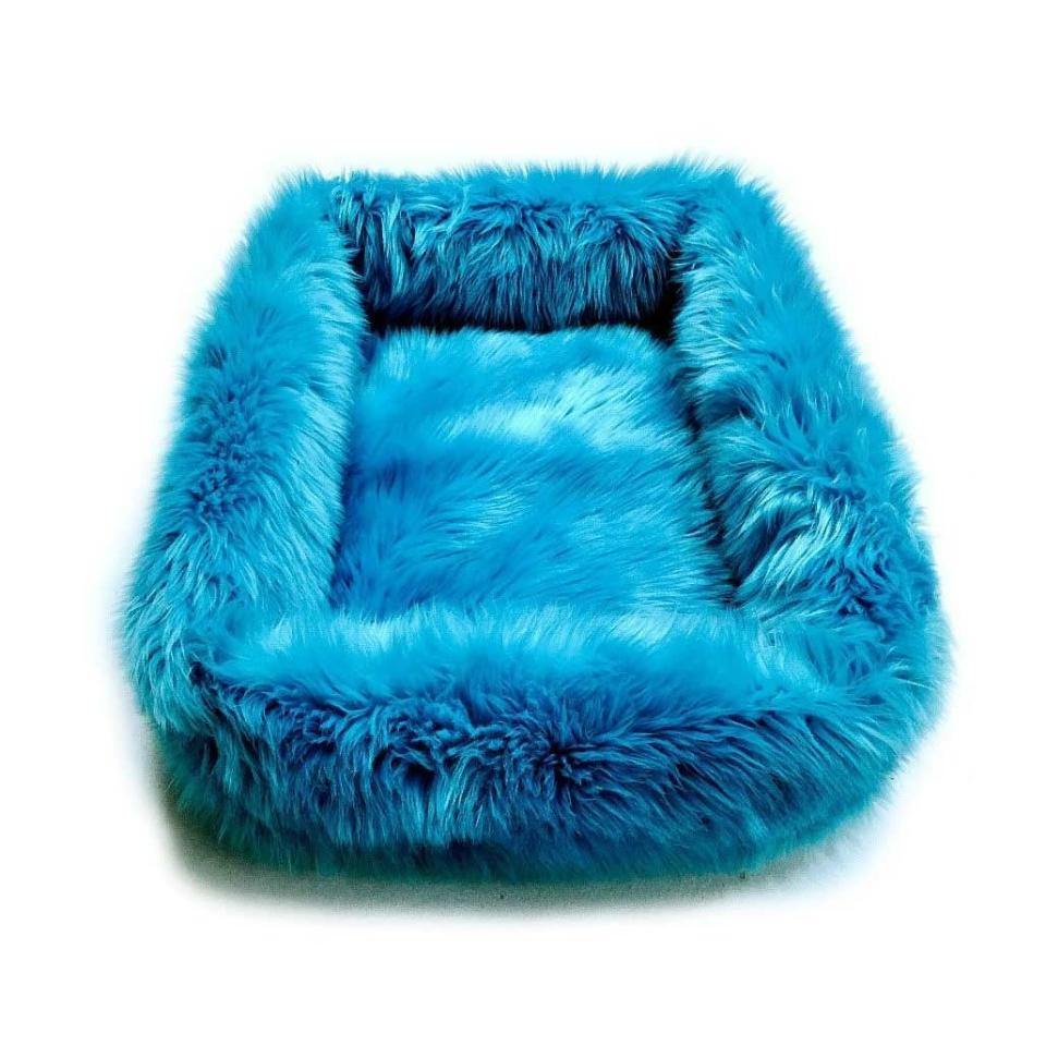 Muppet or dog bed? <a rel="nofollow noopener" href="https://www.etsy.com/listing/512864632/shaggy-soft-padded-luxury-faux-fur?ref=lp_internal-14&pro=1" target="_blank" data-ylk="slk:SHOP NOW;elm:context_link;itc:0;sec:content-canvas" class="link ">SHOP NOW</a>: Faux Fur DogNapper Dog Bed by Fur Accents, from $72, etsy.com