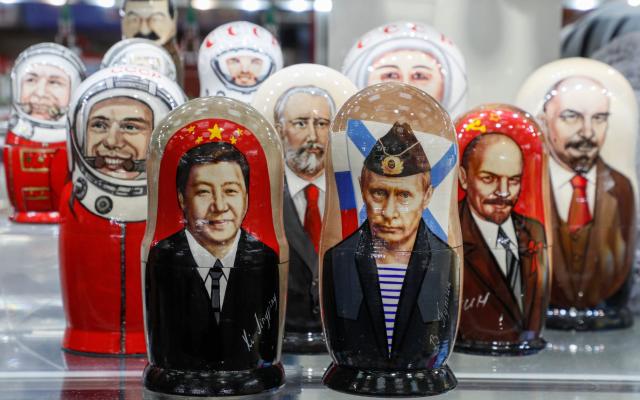 Russian matryoshka dolls with portraits of the Chinese President Xi Jinping and Russian President Vladimir Putin sold on a street souvenir shop in downtown Moscow - YURI KOCHETKOV/EPA-EFE/Shutterstock/Shutterstock