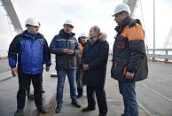 Russian President Vladimir Putin inspects the completed road section of the Crimea Bridge over the Kerch Strait, Crimea, March 14, 2018. Sputnik/Aleksey Nikolskyi/Kremlin via Reuters