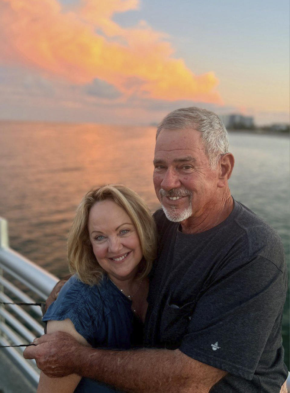 CORRECTS ACCOUNT OF STORY TO INCLUDE: CLAIMED TO SURVIVED DESPITE MULTIPLE ABORTION ATTEMPTS - In this image provided by Miriam "Penny" Hopper, Hopper and her husband Bryan pose for a photo in July 2023. During last week's GOP presidential debate, Florida Gov. Ron DeSantis dodged a question about a federal abortion ban by telling a story about Penny, a woman he knew, who he claimed survived despite multiple abortion attempts.(Miriam "Penny" Hopper via AP)