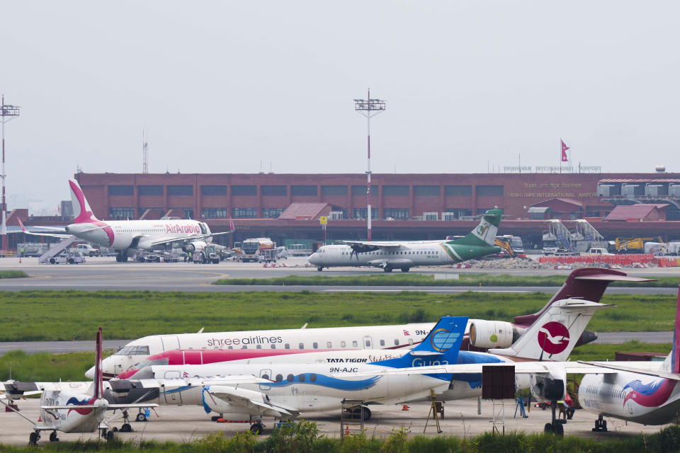 A general view of Tribhuvan International airport in Kathmandu, Nepal, Sunday, May 29, 2022. A small airplane with 22 people on board flying on a popular tourist route was missing in Nepal’s mountains on Sunday, an official said. The Tara Airlines plane, which was on a 15-minute scheduled flight to the mountain town of Jomsom, took off from the resort town of Pokhara, 200 kilometers (125 miles) east of Kathmandu. It lost contact with the airport tower shortly after takeoff. (AP Photo/Niranjan Shreshta)