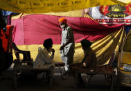 Indian farmers camp at Singhu, along the Delhi-Haryana border, against agricultural laws passed last year that they say will devastate their income, Friday, March 5, 2021. Saturday marks 100 days of the ongoing farmer protests against the contentious new agricultural reform laws which have led tens of thousands of farmers to blockade key highways leading to the capital. Multiple rounds of talks have failed to produce any breakthrough on the farmers' key demand to revoke the legislation. (AP Photo/Manish Swarup)