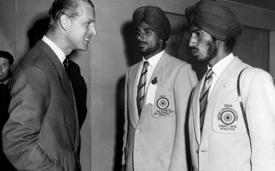 Milkha Singh, right, with his Indian teammate Mohinder Singh, meets the Duke of Edinburgh at the 1958 Empire and Commonwealth Games in Cardiff - S&G and Barratts