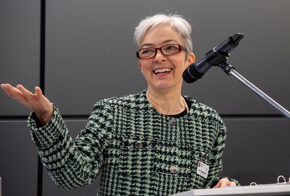 Dr. Irene Porro, direc­tor of the Christa McAuliffe Center for Inte­grated Science Learning, welcomes guests to the center's grand reopening at Framingham State University, Jan. 26, 2024.