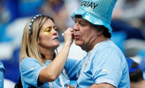 <p>A Uruguay fan has his face painted before the match REUTERS/Jason Cairnduff </p>