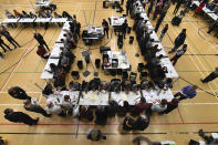 Ballot papers cast in the 2019 general election are counted in Islington in London, Thursday, Dec. 12, 2019. An exit poll in Britain's election projects that Prime Minister Boris Johnson's Conservative Party likely will win a majority of seats in Parliament. That outcome would allow Johnson to fulfil his plan to take the U.K. out of the European Union next month. (AP Photo/Alberto Pezzali)