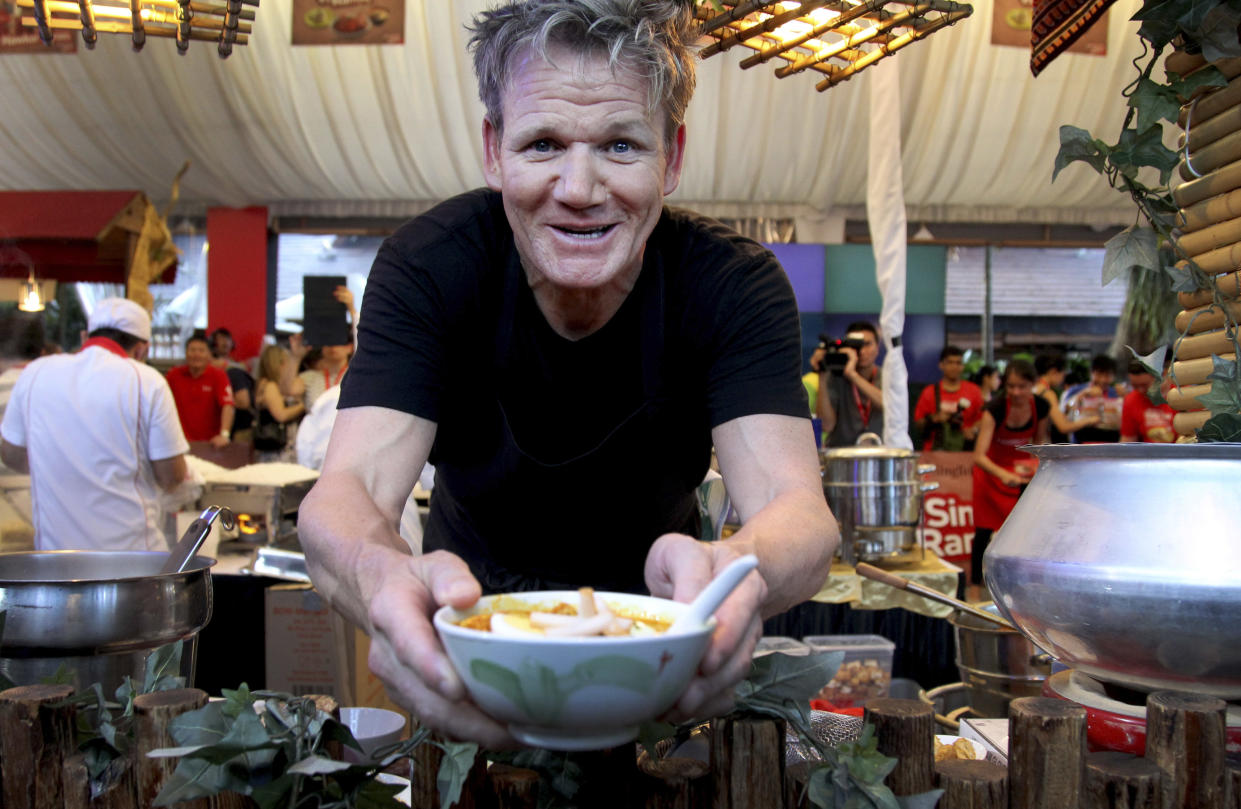 FILE - In this Sunday, July 7, 2013 file photo, celebrity Michelin-starred chef Gordon Ramsay serves up a bowl of 