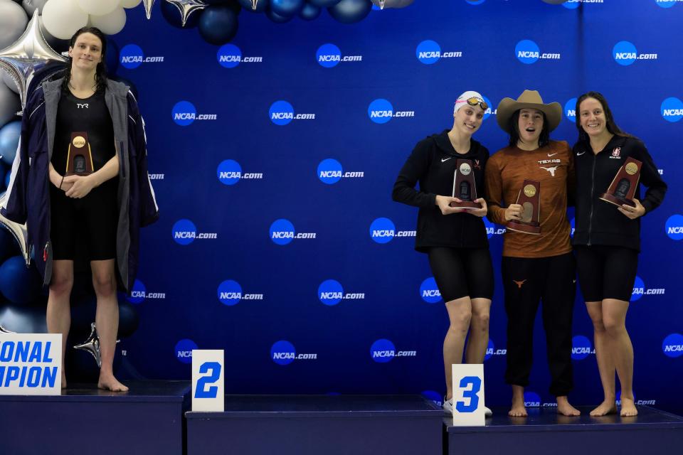 Swimmer Lia Thomas on the podium after winning the 500 yard race at the 2022 NCAA Championships.