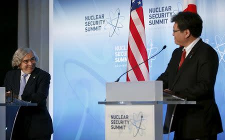 U.S. Secretary of Energy Ernest Moniz (L) and Japan's Deputy Chief Cabinet Secretary Koichi Hagiuda (R) hold a joint press statement at the Nuclear Security Summit in Washington April 1, 2016. REUTERS/Gary Cameron