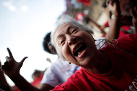 Supporters of imprisoned former Brazil's President Luis Inacio Lula da Silva attend a march before his Workers' Party (PT) officially registers his presidential candidacy, in Brasilia, Brazil, August 15, 2018. REUTERS/Ueslei Marcelino