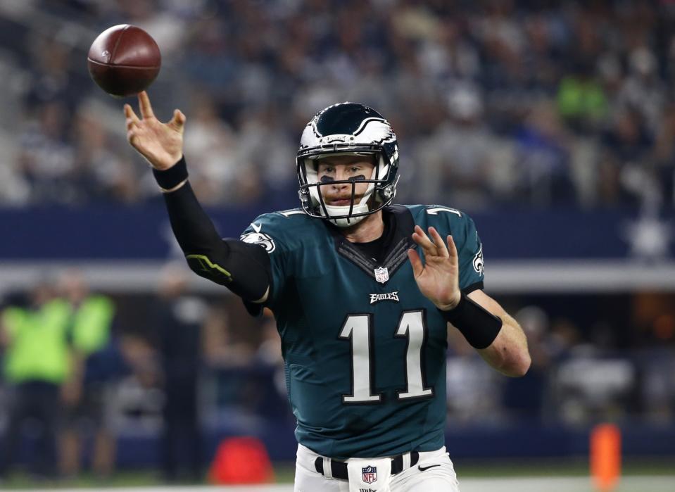 Carson Wentz's receivers have let him down, but the Philadelphia Eagles need to let him throw more vertically. (AP)