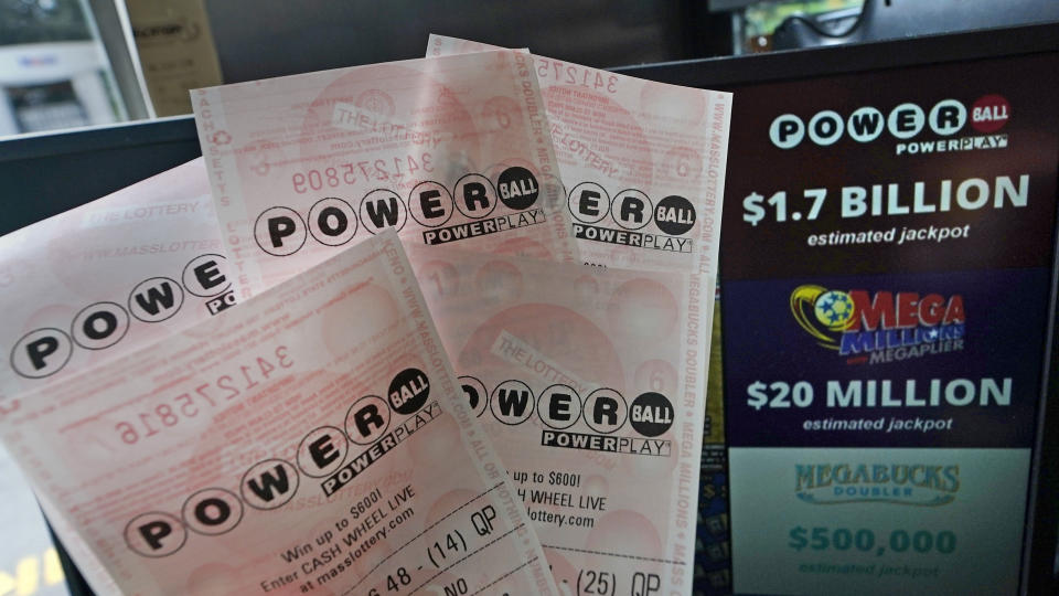 Powerball tickets are shown at a lottery agent, Tuesday, Oct. 10, 2023, in Haverhill, Mass. After 35 straight drawings without a big winner, Powerball players will have a shot Wednesday at a near-record jackpot worth an estimated $1.73 billion. (AP Photo/Charles Krupa)