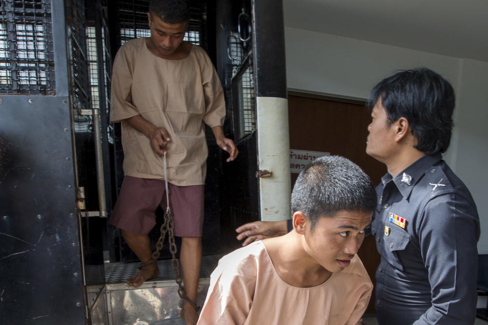 Myanmar migrant workers Zaw Lin (C) and Wai Phyo (L), also known as Win Zaw Htun, arrive at the Koh Samui Provincial Court, in Koh Samui, Thailand, July 8, 2015. The two men are on trial for the murder of Hannah Witheridge, 23, and David Miller, 24, in September last year on a beach on Koh Tao, an island popular with backpackers and divers.   REUTERS/Athit Perawongmetha/Files