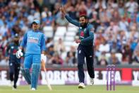 Cricket - England v India - Third One Day International - Emerald Headingley, Headingley, Britain - July 17, 2018 England's Adil Rashid celebrates taking the wicket of India's Suresh Raina Action Images via Reuters/Ed Sykes