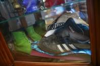 Shoes that were worn by Martin Szczupak, who died of a drug overdose in upstate New York, are seen in a case at his mother's home in the Staten Island borough of New York August 19, 2015. REUTERS/Shannon Stapleton
