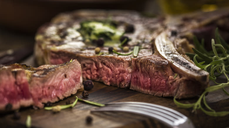 Steak with fork in foreground 