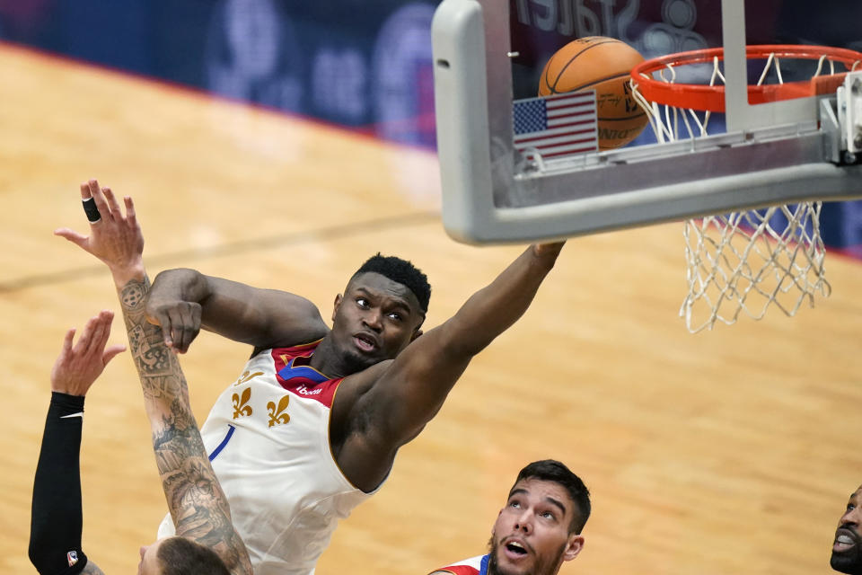 New Orleans Pelicans forward Zion Williamson (1) goes to the basket in the first half of an NBA basketball game against the Boston Celtics in New Orleans, Sunday, Feb. 21, 2021. (AP Photo/Gerald Herbert)