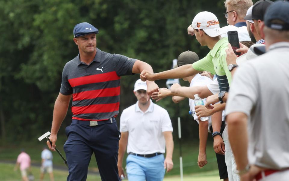 Bryson DeChambeau of the United States greets fans - Getty Images