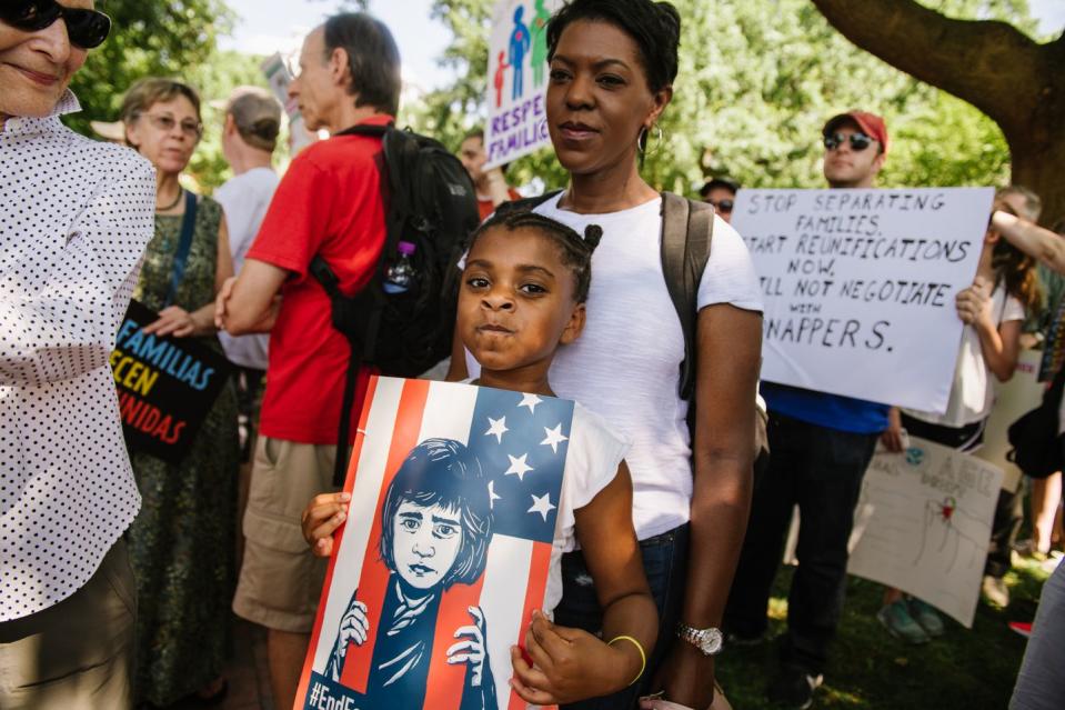 <p>“We’re marching because parents shouldn’t be separated from their kids." - Savannah Martin, 7, with her mother, Tamika Martin </p>