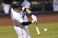 Miami Marlins' Chad Wallach hits a sacrifice fly to score Brian Anderson during the seventh inning of a baseball game against the Arizona Diamondbacks, Thursday, May 6, 2021, in Miami. (AP Photo/Lynne Sladky)