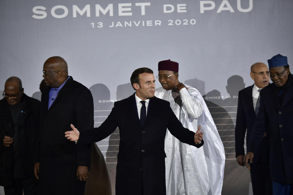 French President Emmanuel Macron, center, poses with G5 African heads of state after the G5 Sahel summit in Pau, southwestern France, Monday Jan.13, 2020. France is preparing its military to better target Islamic extremists in a West African region that has seen a surge of deadly violence. (AP Photo/Alvaro Barrientos)