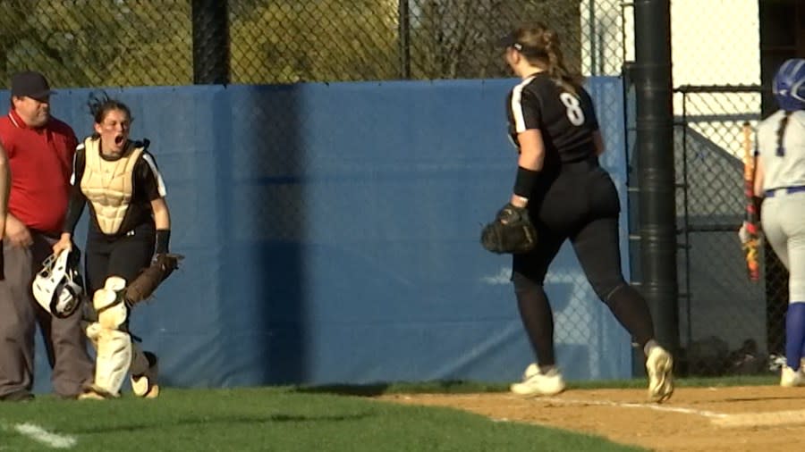 <em>Corning catcher Sophia Polzella celebrates after throwing out a Horseheads runner, on a banner day. </em>