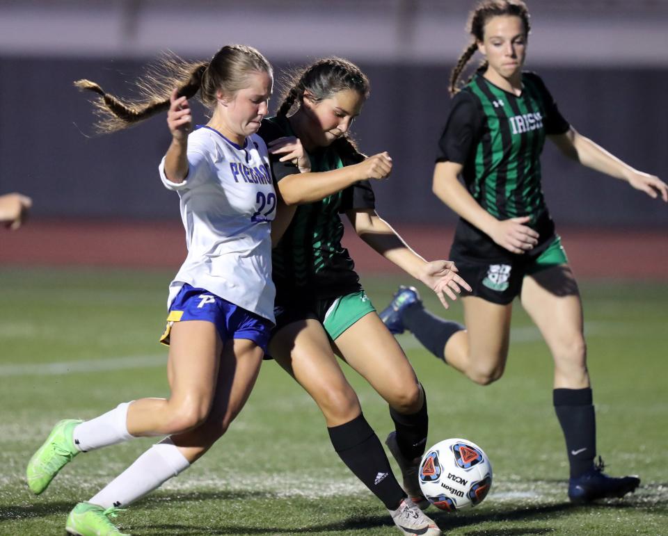 PiedmontÕs Jordan Hahn and Elle Torres collide as Piedmont plays Bishop McGuinness during the Class 5A high school state girls soccer finals on May 13, 2022 at Taft Stadium School in Oklahoma City, Okla.