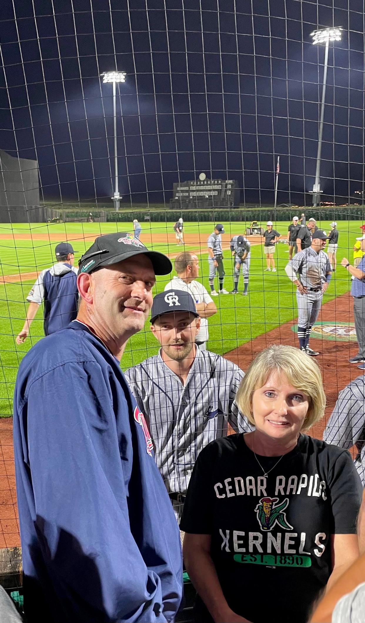 Barb and Dan Mullenbach and son Matt of Waukee stand for a photo at the Field of Dreams in Dyersville on Tuesday, Aug. 9. Matt pitched an inning of scoreless relief for the Cedar Rapids Kernels in the first minor-league baseball game played at the iconic site.