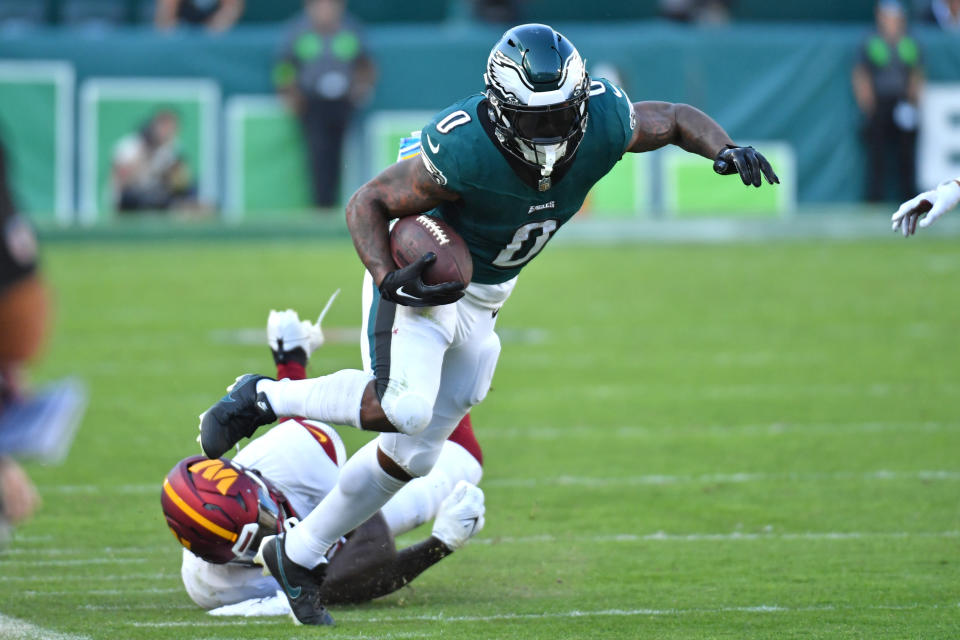 Oct 1, 2023; Philadelphia, Pennsylvania, USA; Philadelphia Eagles running back <a class="link " href="https://sports.yahoo.com/nfl/players/32705" data-i13n="sec:content-canvas;subsec:anchor_text;elm:context_link" data-ylk="slk:D’Andre Swift;sec:content-canvas;subsec:anchor_text;elm:context_link;itc:0">D’Andre Swift</a> (0) avoids tackle by Washington Commanders linebacker <a class="link " href="https://sports.yahoo.com/nfl/players/33407" data-i13n="sec:content-canvas;subsec:anchor_text;elm:context_link" data-ylk="slk:Jamin Davis;sec:content-canvas;subsec:anchor_text;elm:context_link;itc:0">Jamin Davis</a> (52) in overtime at Lincoln Financial Field. Mandatory Credit: Eric Hartline-USA TODAY Sports