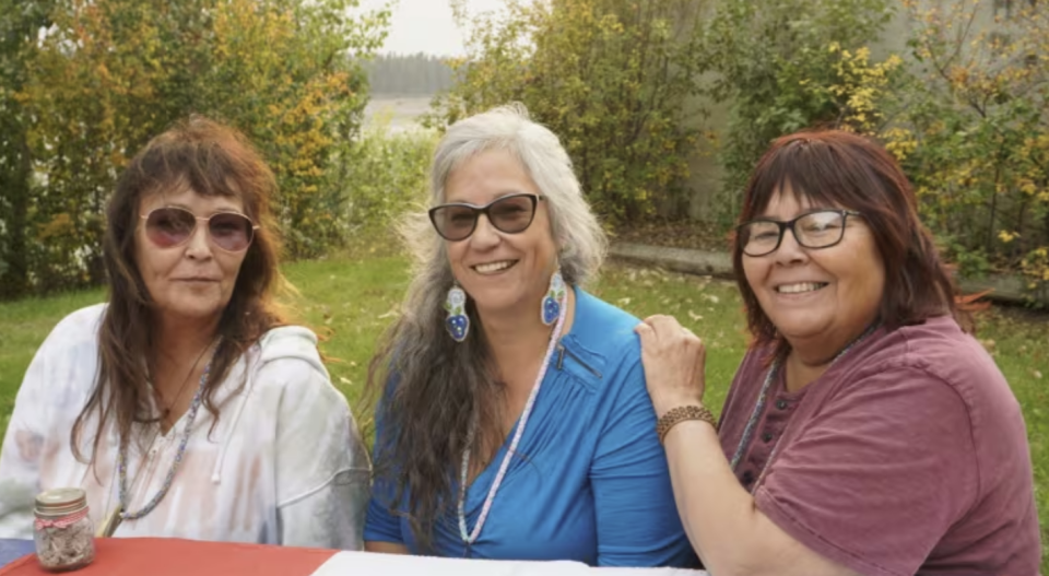 Delphine Gargan, RavenSong Gargan and Sariah Stanley are all survivors of the Sixties Scoop. They have found each other and reunited in Fort Providence – where their mother grew up and where Delphine was born – for the first time. (Courtesy: CBC News)