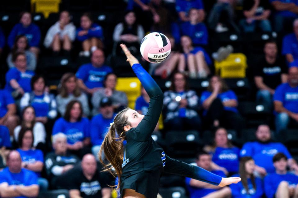 Dike-New Hartford's Payton Petersen (21) serves during a Class 2A state volleyball semifinal match